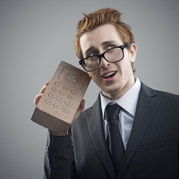 Portrait of mad Nerdy businessman with a unusual cell phone