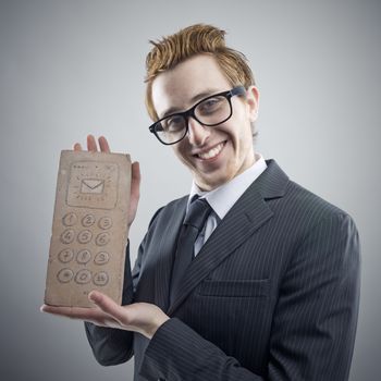 Portrait of mad Nerdy businessman with a unusual cell phone