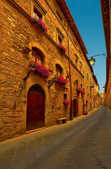 Narrow Alley with Old Buildings in Italian City of Siena
