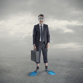 Businessman wearing scuba mask and flippers.