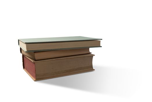 Pile of three old books on white background.