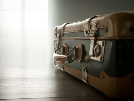 Vintage suitcase on a table, travel concept.