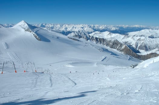 Ski slopes on Hintertux glacier in Alps nearby Zillertal valley in Austria