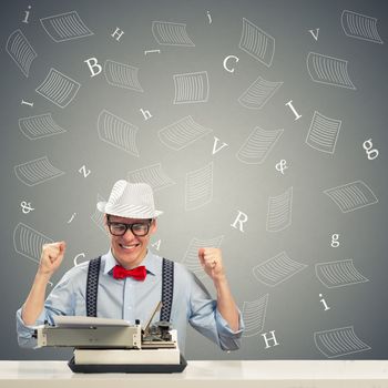 image of a young journalist, sitting at the table for a typewriter