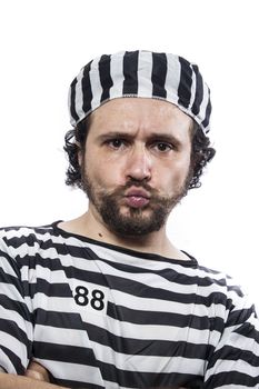 Illegal, Desperate, portrait of a man prisoner in prison garb, over white background