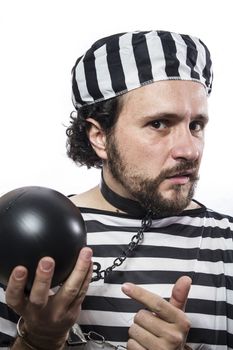 Solution, one caucasian man prisoner criminal with chain ball and handcuffs in studio isolated on white background