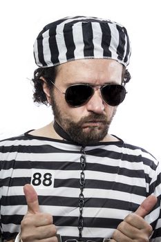 Prison, one caucasian man prisoner criminal with chain ball and handcuffs in studio isolated on white background