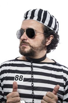 one caucasian man prisoner criminal with chain ball and handcuffs in studio isolated on white background