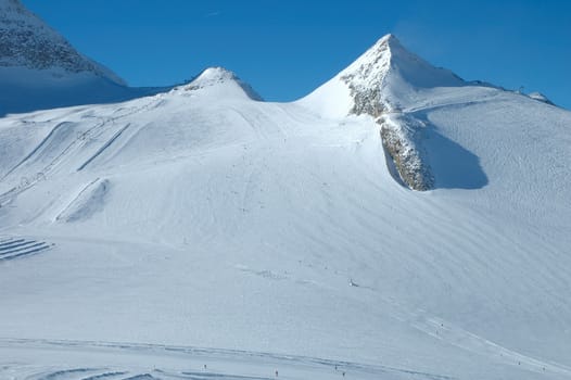 Ski slopes on Hintertux glacier in Alps nearby Zillertal valley in Austria