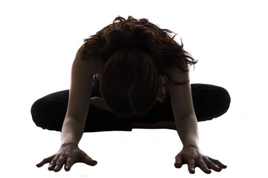 Woman is doing Bound Angle Pose in Yoga.