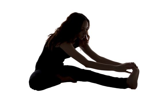 Woman is doing Head to Knee Pose in Yoga.