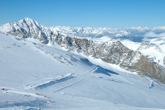Ski slopes on Hintertux glacier in Alps nearby Zillertal valley in Austria