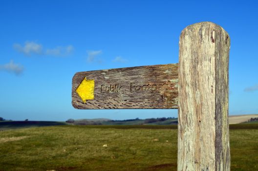 Traditional wooden direction sign informing that there is a public right of way in the direction of the arrow.