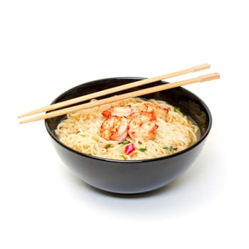 Shrimp and noodle soup bowl with chopsticks on white background