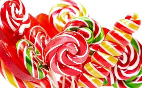 Multi-colored lollypop, closeup on a white background