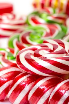 Multi-colored lollypop, closeup on a white background