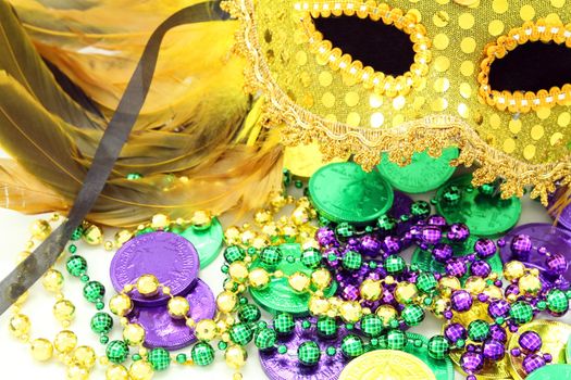 Mardi Gras mask with beads and doubloons