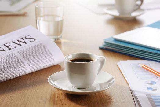 Business Office scene, Coffee, newspaper, water glass on meeting desk