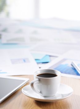 Business Office scene, documents and coffee on desk