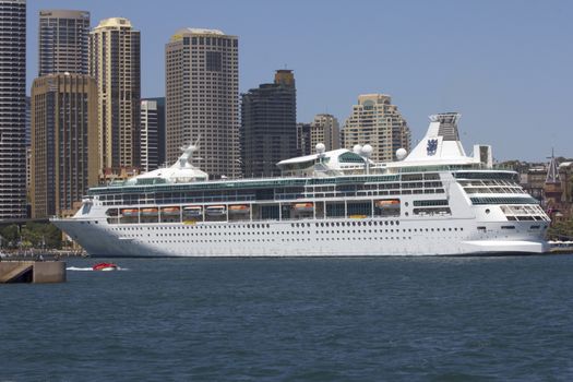 SYDNEY, AUSTRALIA-December 19th 2913: The cruise ship Rhapsody of the Seas, moored at Circular Quay in Sydney Harbour. The ship is owned by Royal Caribbean International and was the subject of a $54 million refit in 2012.