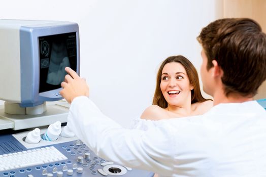 young pregnant woman on the ultrasound, health check