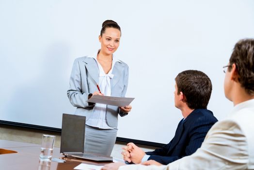 image of a discusses business woman with colleagues