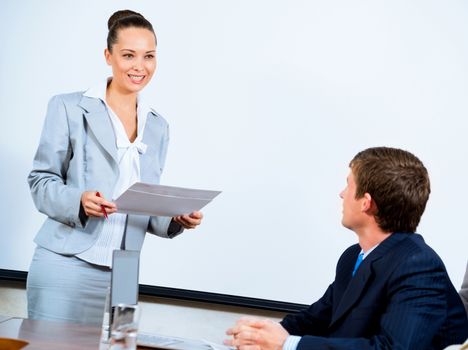 image of a discusses business woman with colleagues