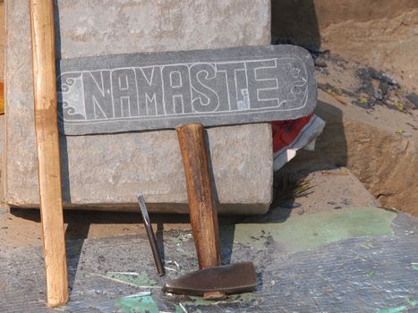 namaste sign made in stone      