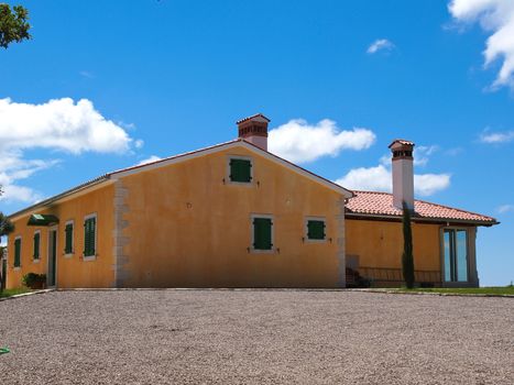 yellow house and blue sky