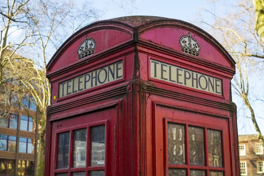 Close up of old red telephone booth in London, UK