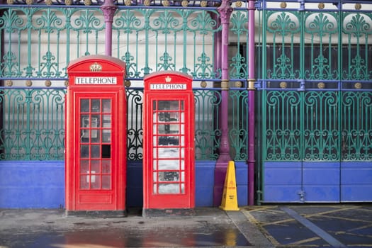 Old red telephone booth in Smithfield meat market in London, UK