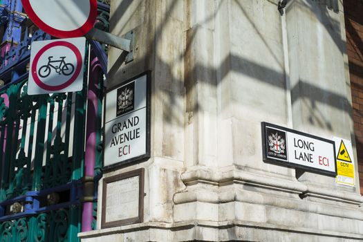 LONDON, UK - FEBRUARY 16: Street signs in the nearly one thousand years old Smithfield market. The current building is over one hundred and forty years old. February 16, 2014 in London.