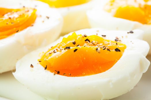 Fresh boiled eggs with spices close up