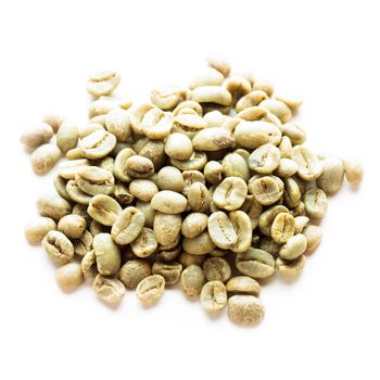 Green coffee beans heap isolated on white