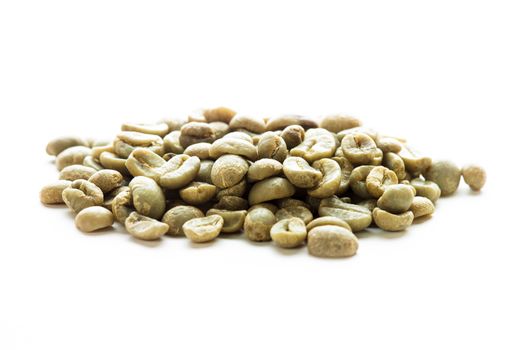 Green coffee beans heap isolated on white