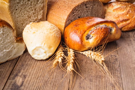 Types of homemade bread on the rustic wooden table