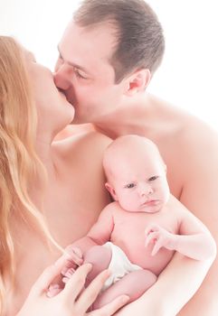 Mother and father with newborn baby close up