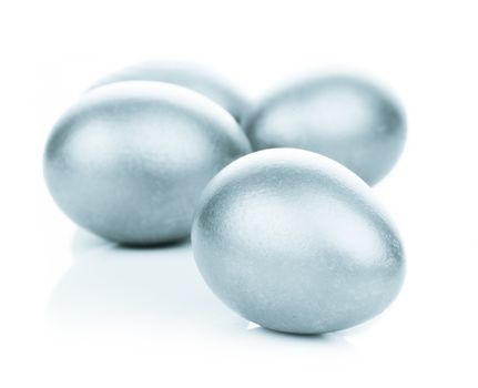 Four silver eggs isolated on white background