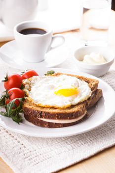 Breakfast with coffee, Croque Madame sandwich close up