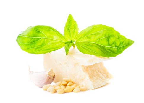Pesto sauce ingredients: fresh green basil, parmesan, pine nuts and garlic. On white