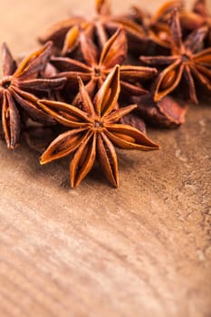 Anise stars heap on the wooden table