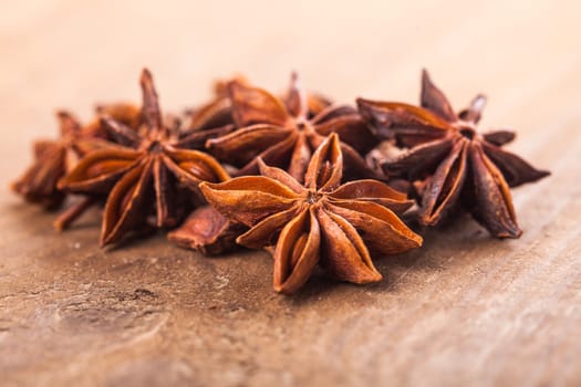 Anise stars heap on the wooden table