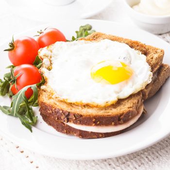 Breakfast with coffee, Croque Madame sandwich close up