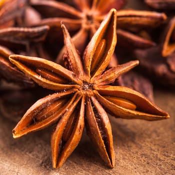 Anise stars heap on the wooden table