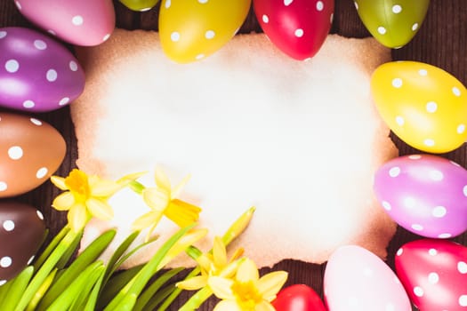 Colorful polka dot eggs and empty greeting card. Easter decorations