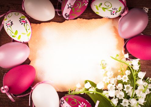 Purple and white eggs and empty greeting card. Easter decorations