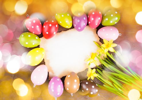 Colorful polka dot eggs and empty greeting card. Easter decorations