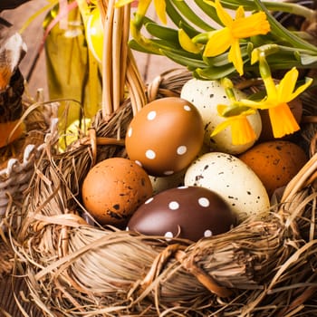 Brown and yellow eggs in basket, Easter decorations