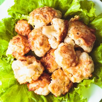 Fried cauliflower closeup on the plate on a table