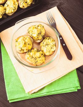 Stuffed baked potato with eggs, cheese and spices